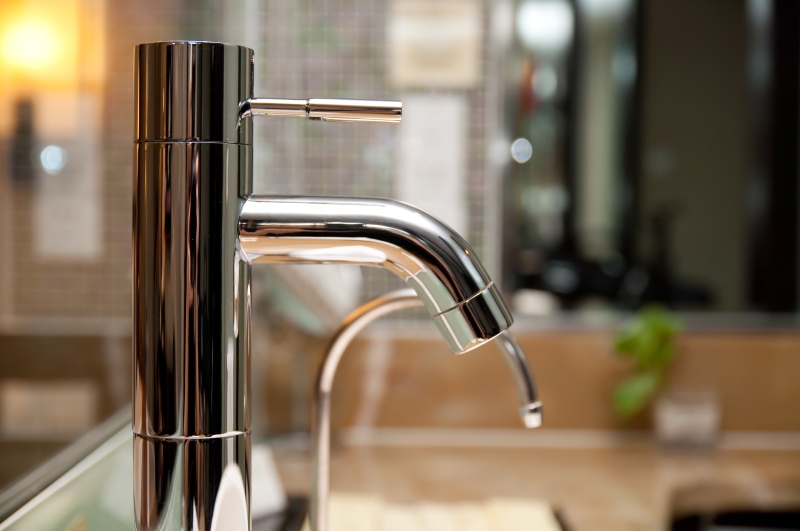 Leaking tap being repaired in Peckham